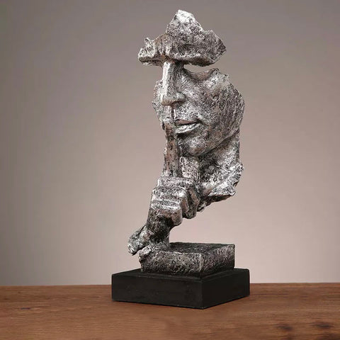 Manngesichtsstatue<br> Schweigen ist Gold