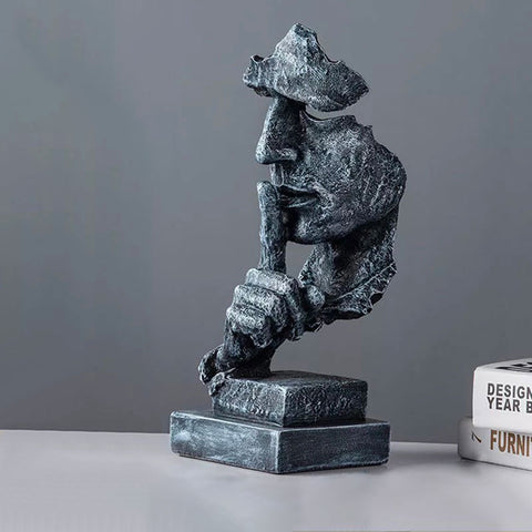 Manngesichtsstatue<br> Schweigen ist Gold