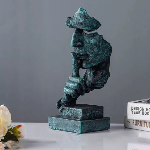 Manngesichtsstatue<br> Schweigen ist Gold