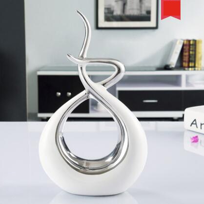 Abstrakte Skulptur<br> Goldene Umarmung